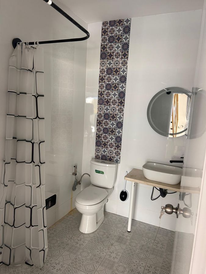 Bathroom with shower and basin